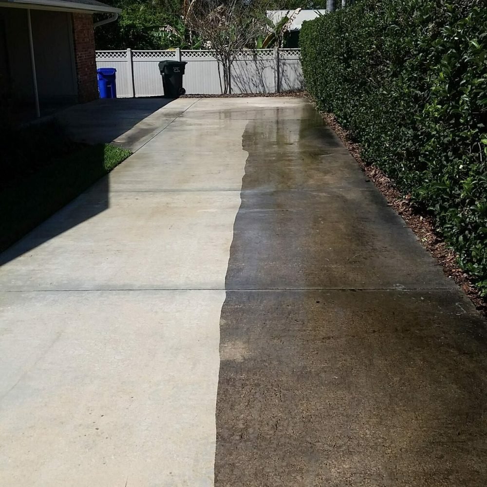 Driveway half pressure washed clean